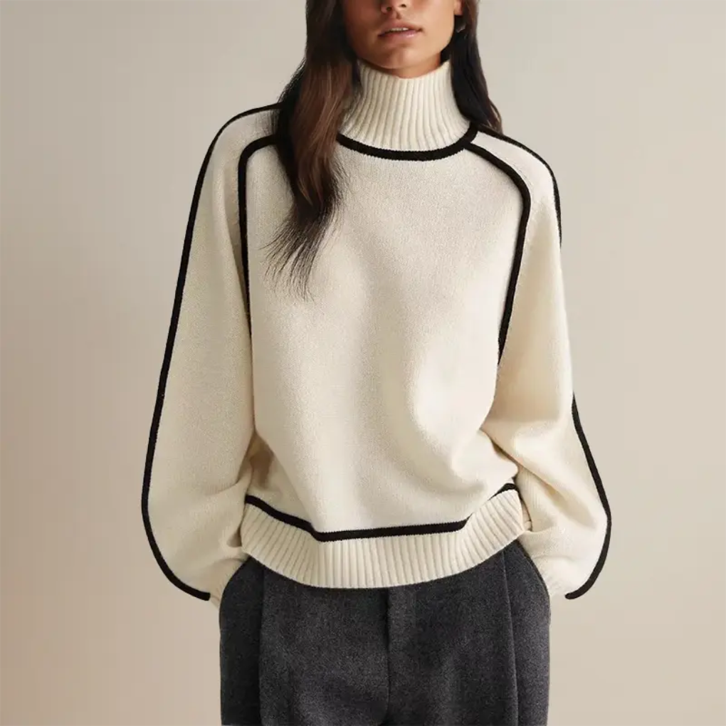 Blød rullekravebluse med strikket design