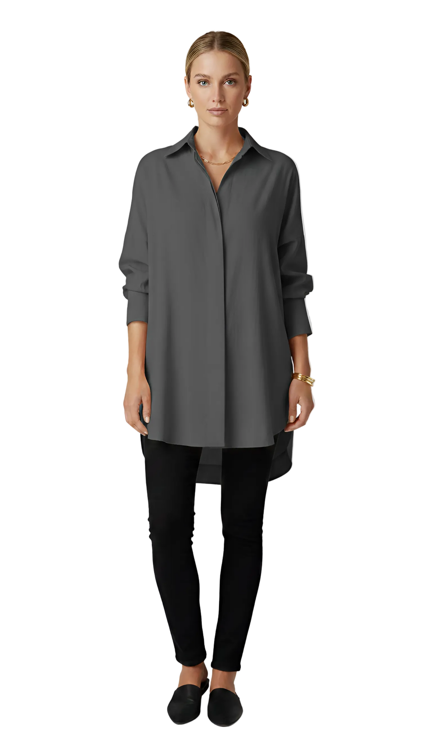 Woman wearing a gray long-sleeve shirt and black pants on a white background