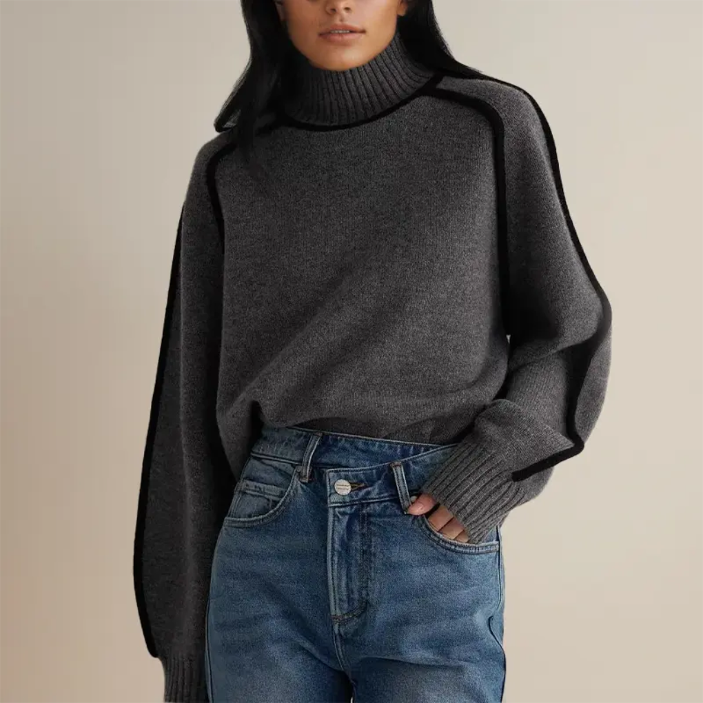 Blød rullekravebluse med strikket design